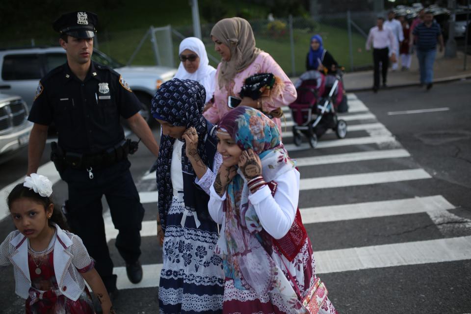 Muslims walk to Bensonhurst Park to perform Eid-al-Fitr prayer in Brooklyn borough of New York, United States on June 25, 2017. Eid-al-Fitr is a holiday celebrated by Muslims worldwide that marks the end of Muslims' holy month of fasting Ramadan.