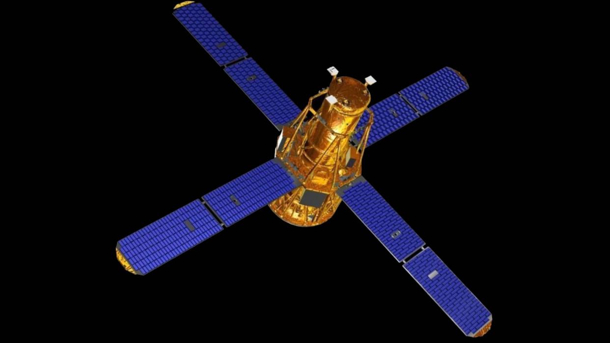  an illustration of a satellite with four solar panels arranged in a cross shape 