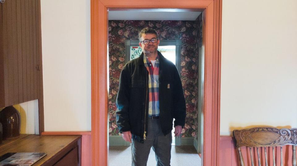 Josh Silver, lead Learning Manager for the Heritage Retrofit Carpentry Program at Holland College, stands in one of the doorways at Green Gables house.  