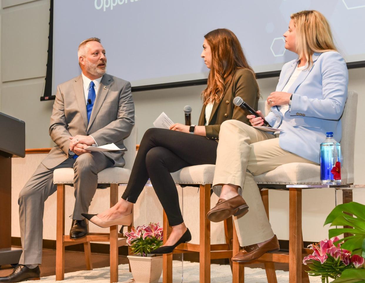 Goodwill Southeast Georgia President and CEO Jason Marshall leads a panel discussion on workforce partnerships with United Way of the Coastal Empire's Chief Impact Officer Leia Dedic and Regional Industry Support Enterprise President and CEO Anna Chafin on May 17, 2024.