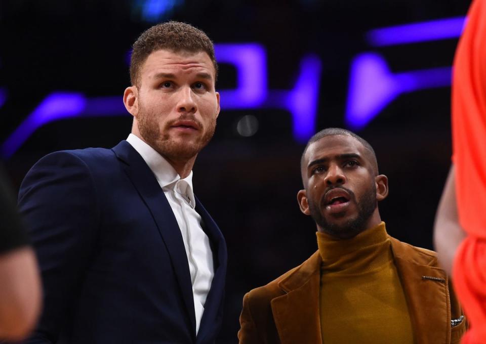 Blake Griffin and Chris Paul have been watching from the sidelines, and the Clippers aren't putting on a very good show. (Getty Images)