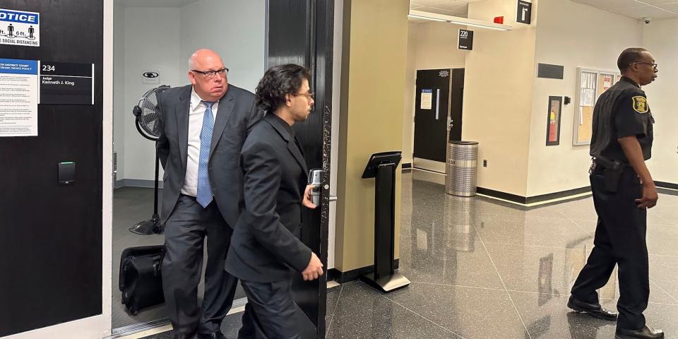 Detroit Mobil clerk Al-Hassan Aiyash leaving court with his attorney on Tuesday, June 6, 2023.