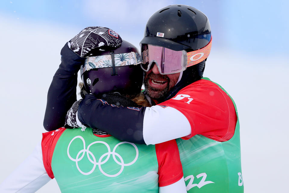 Lindsey Jacobellis and Nick Baumgartner of Team United States (R) celebrate winning the gold medal during the snowboard mixed team cross big final at the Beijing 2022 Winter Olympics. (Cameron Spencer/Getty Images)