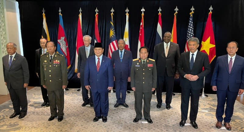 Singapore's Minister for Defence Dr Ng Eng Hen and the U.S. Defense Secretary Lloyd Austin pose for a group photo with Southeast Asia Defence Ministers and their representatives on the sidelines of the 20th Shangri-La Dialogue in Singapore