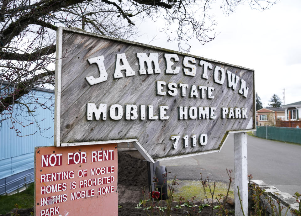 A sign seen on March 25, 2023, shows the previous name of the mobile home park in Lakewood, Wash., that became Bob’s and Jamestown Homeowners Cooperative when residents bought it. When residents learned the park’s owner was looking to sell, they formed a cooperative and bought it themselves amid worries it would be redeveloped. Since becoming owners in September 2022, residents have worked together to manage and maintain the park. (AP Photo/Lindsey Wasson)