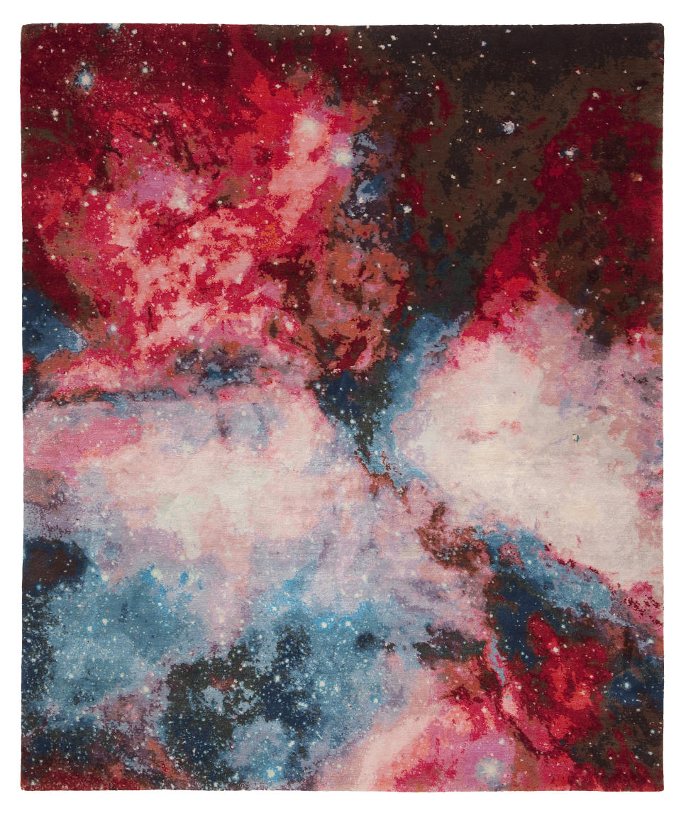 This image provided by Jan Kath Design GmbH shows an outer space themed rug. German designer Jan Kath has created a rug collection called Spacecrafted inspired by imagery of gas clouds and asteroid nebulae from the Hubble telescope. (Dimo Feldmann/Jan Kath Design GmbH via AP)