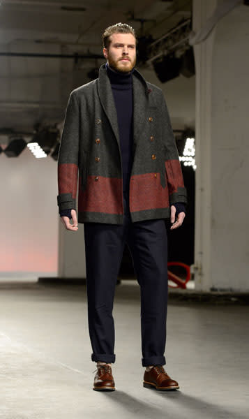 <b>Rick Edwards</b><br><br>The former T4 presenter modelled for the Oliver Spencer AW13 show, sporting a navy jumper, navy chinos, tan brogue shoes and a tweed military-style coat.