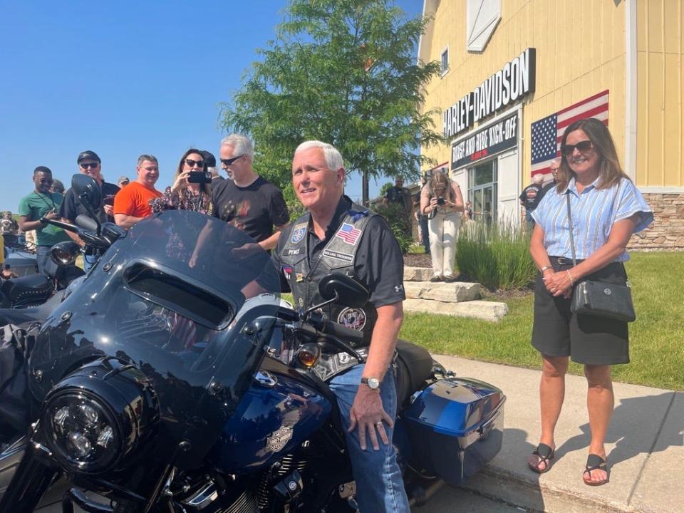 Mike Pence gets on his motorcycle ahead of Joni Ernst's Roast and Ride on June, 3 2023 in Des Moines.