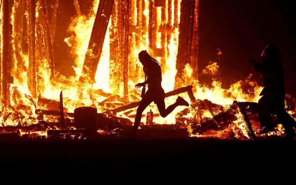 A man managed to run into the burning effigy at the festival: Reuters