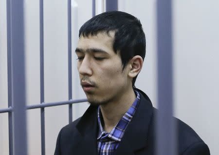 Abror Azimov, a suspect over the recent bombing of a metro train in St. Petersburg, sits inside the defendant's cage as he attends a court hearing in Moscow, Russia, April 18, 2017. REUTERS/Sergei Karpukhin