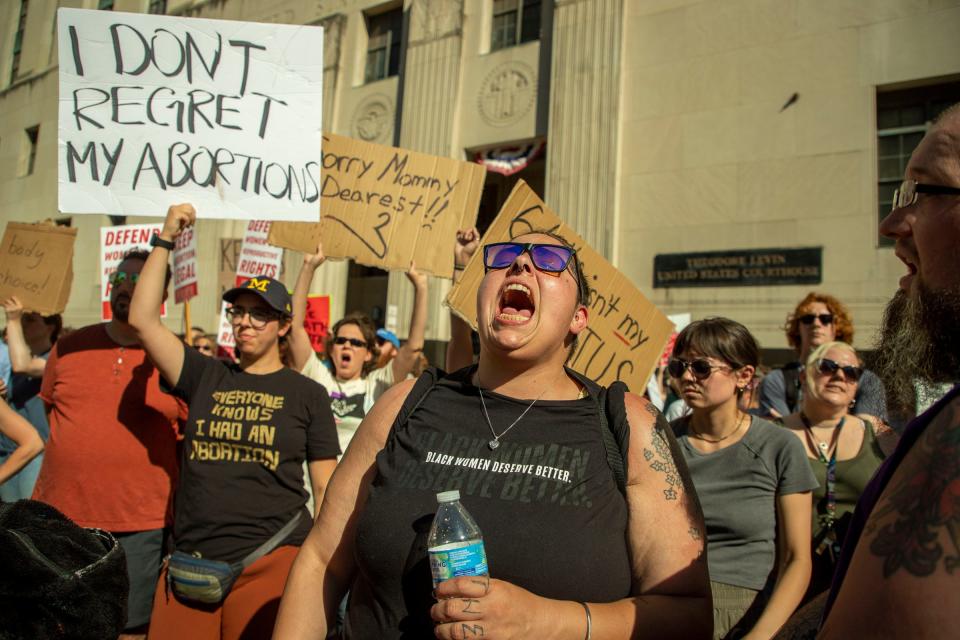 Abortion-rights protesters march through downtown Detroit following a rally at the Theodore Levin Federal Court building in Detroit to protest against the U.S. Supreme Court decision to overturn Roe v. Wade on June 24, 2022.