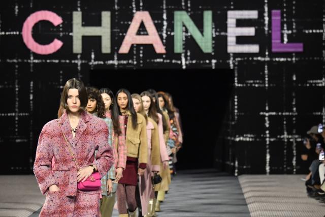 Climate activists storm Louis Vuitton catwalk