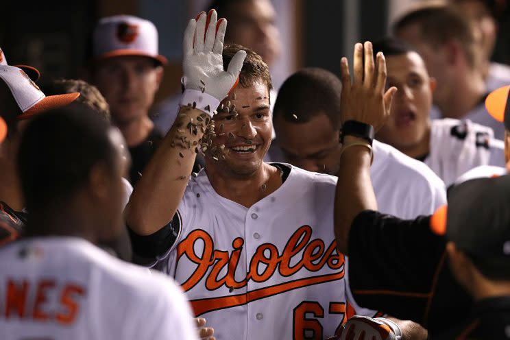 BALTIMORE, MD - SEPTEMBER 20: Trey Mancini #67 of the Baltimore Orioles is greeted in the dugout by teammates after hitting a home run during the fifth inning against the Boston Red Sox at Oriole Park at Camden Yards on September 20, 2016 in Baltimore, Maryland. (Photo by Patrick Smith/Getty Images)