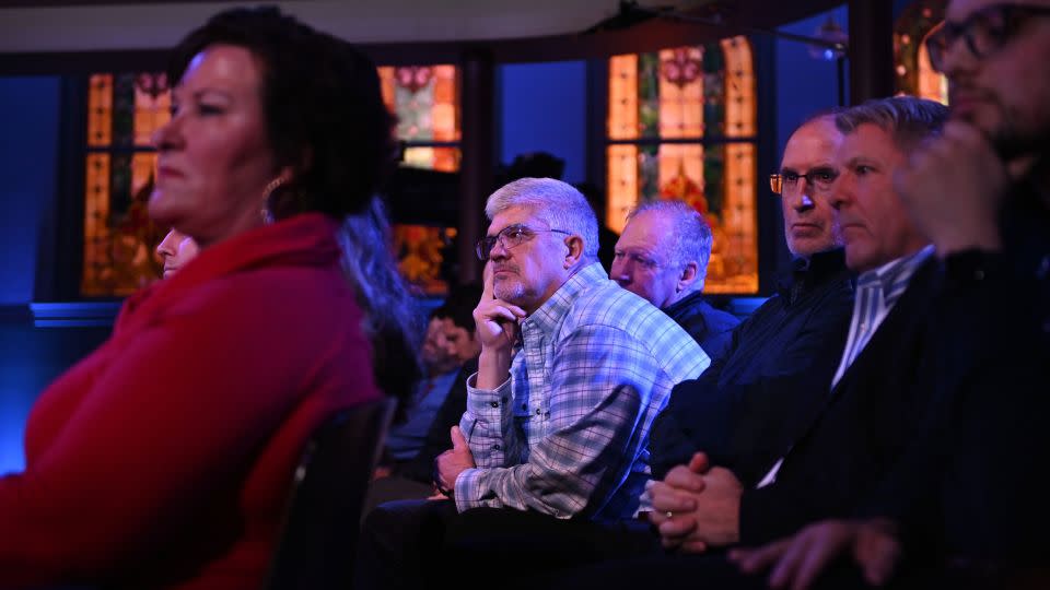 An audience member listens during the debate as Haley and DeSantis answer questions. - Will Lanzoni/CNN