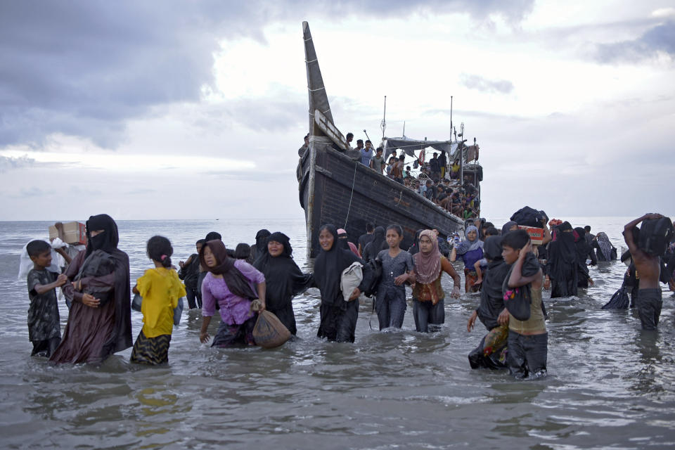 FILE - Ethnic Rohingya disembark from their boat upon landing on a beach in Ulee Madon, North Aceh, Indonesia, Thursday, Nov. 16, 2023. The U.N. refugee agency on Monday Dec. 4, 2023 sounded the alarm for hundreds of Rohingya Muslims believed to be aboard two boats reported to be out of supplies and adrift on the Andaman Sea. (AP Photo/Rahmat Mirza, File)