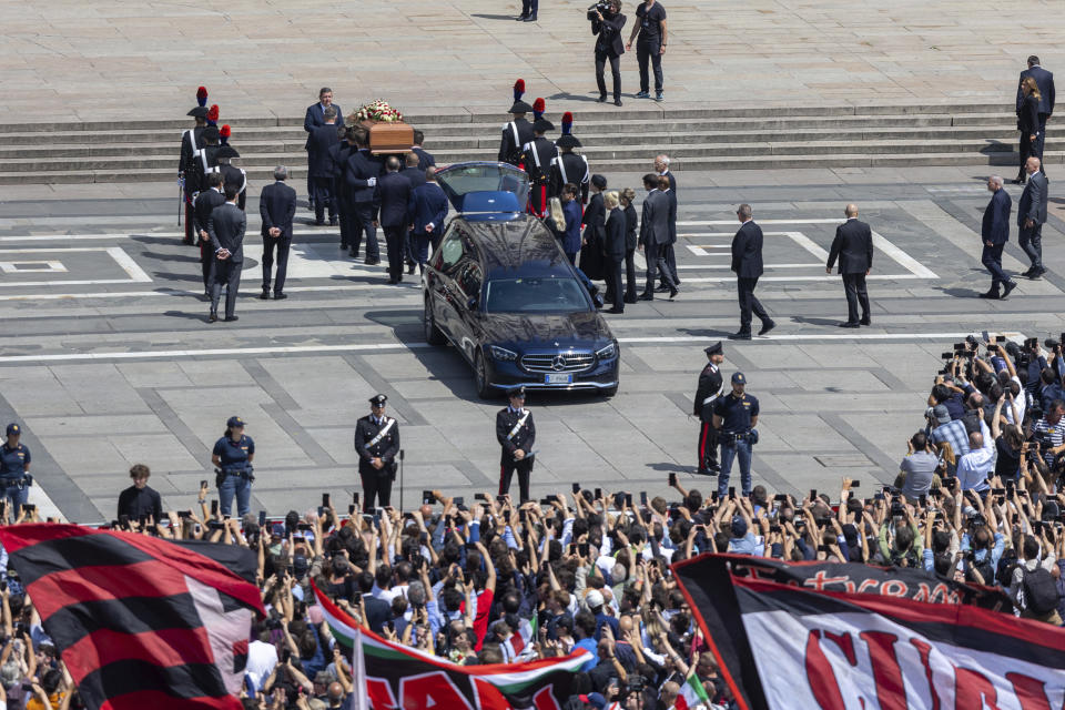 The casket of former Italian premier Silvio Berlusconi is carried for his state funeral in Milan's Duomo Gothic-era Cathedral, Italy, Wednesday, June 14, 2023. Berlusconi died at the age of 86 on Monday in a Milan hospital where he was being treated for chronic leukemia. (Stefano Porta/LaPresse via AP)