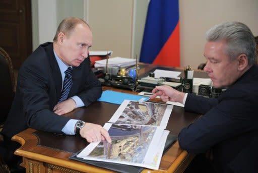 Prime Minister Vladimir Putin, pictured with Moscow Mayor Sergei Sobyanin, plans to toughen up immigration legislation, saying those who want to work in Russia will have to pass basic tests