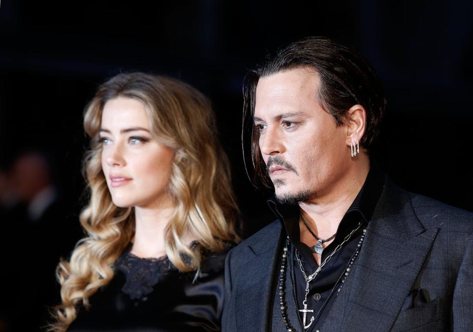 Heard (L) has faced the heat since losing defamation case brought by Johnny Depp (R) (getty)