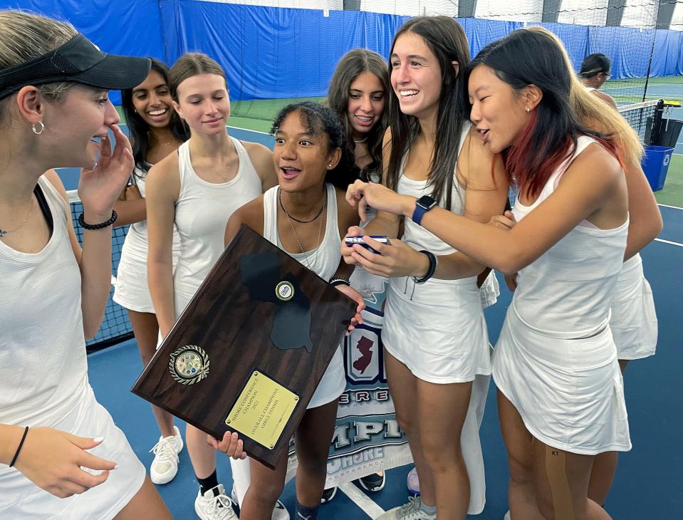 Marlboro's first doubles player Klarissa Salfarlie holds the Shore Conference Girls Tennis championship plaque after the Mustangs' 4-1 win over Holmdel Monday in the SCT final.