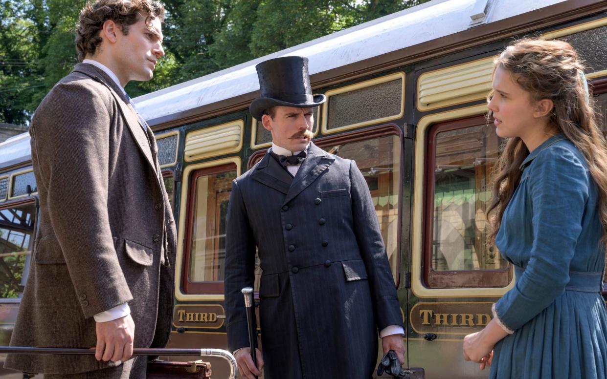 Henry Cavill, Sam Claflin and Millie Bobby Brown in a scene from Enola Holmes - Netflix