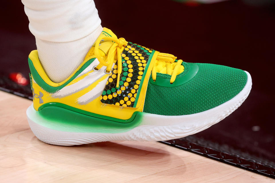 Patty Mills, part of Team Australia, wears these effervescent and vibrant Under Armour shoes during the men’s basketball preliminary round group-B game at the Saitama Super Arena on July 25. - Credit: AP