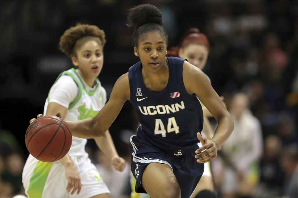 Connecticut's Aubrey Griffin (44) drives the ball upcourt against South Florida during the second half of an NCAA college basketball game Sunday, Feb. 16, 2020, in Tampa, Fla. (AP Photo/Mike Carlson)