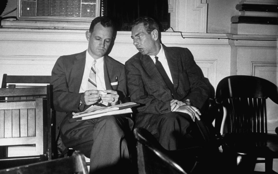 Sen. Mills Godwin, left, speaks with an unidentified man during his support of bills introduced to state legislature by Gov. Thomas B. Stanley in defiance of Supreme Court decision banning segregation in public schools. (Photo: Margaret Bourke-White/LIFE Picture Collection/Getty Images)