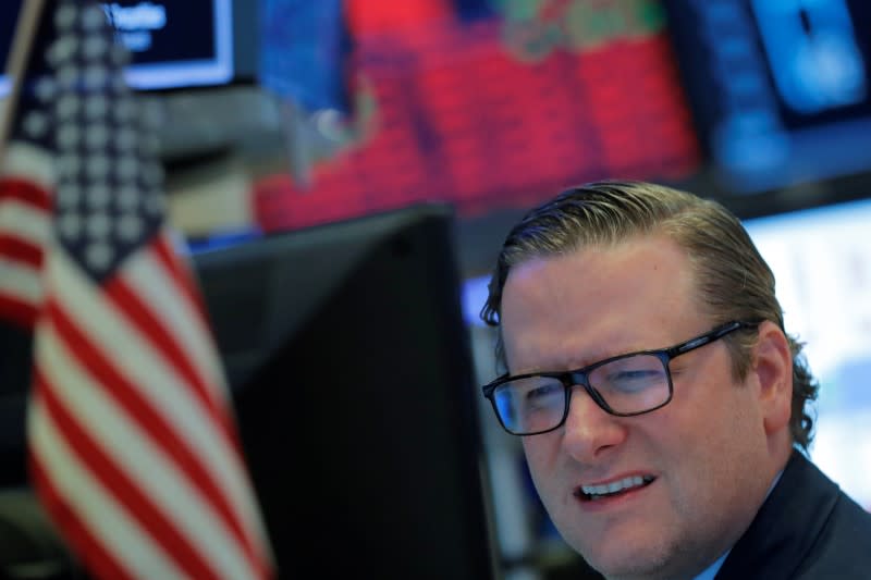 Traders work on the floor of the New York Stock Exchange (NYSE) in New York