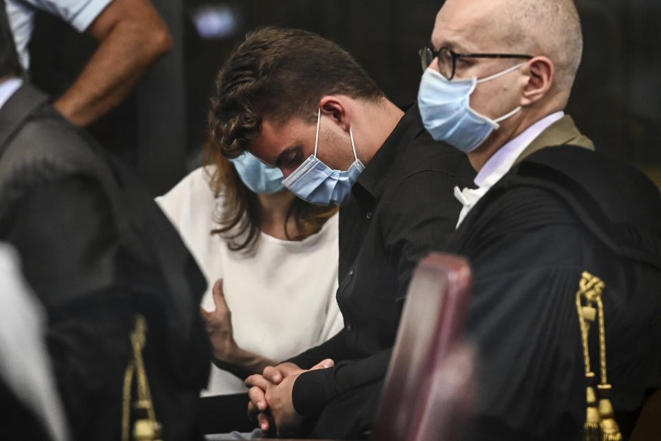 Gabriel Natale Hjorth, from the United States, center, arrives in the courtroom for the trial of the killing of Italian Carabinieri police officer Mario Cerciello Rega, in Rome, Wednesday, July 22, 2020. Two tourists from California are accused of murdering Cerciello during their summer vacation in Italy in July 2019. (Andreas Solaro/Pool via AP)