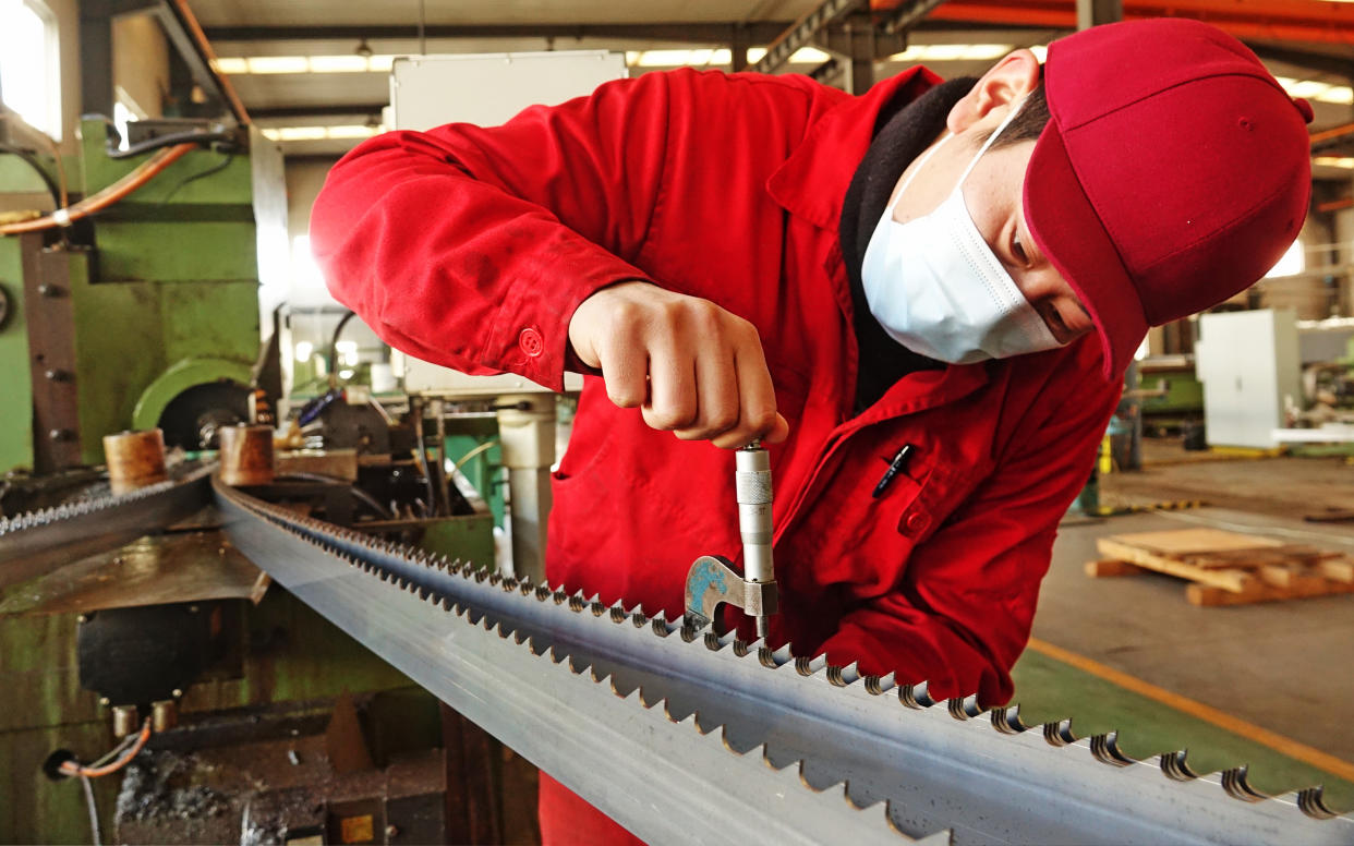 A staff member works on a production line of Dalian Special Steel Products Co Ltd in Dalian, Liaoning Province of China. Photo: Liu Debin/VCG via Getty Images