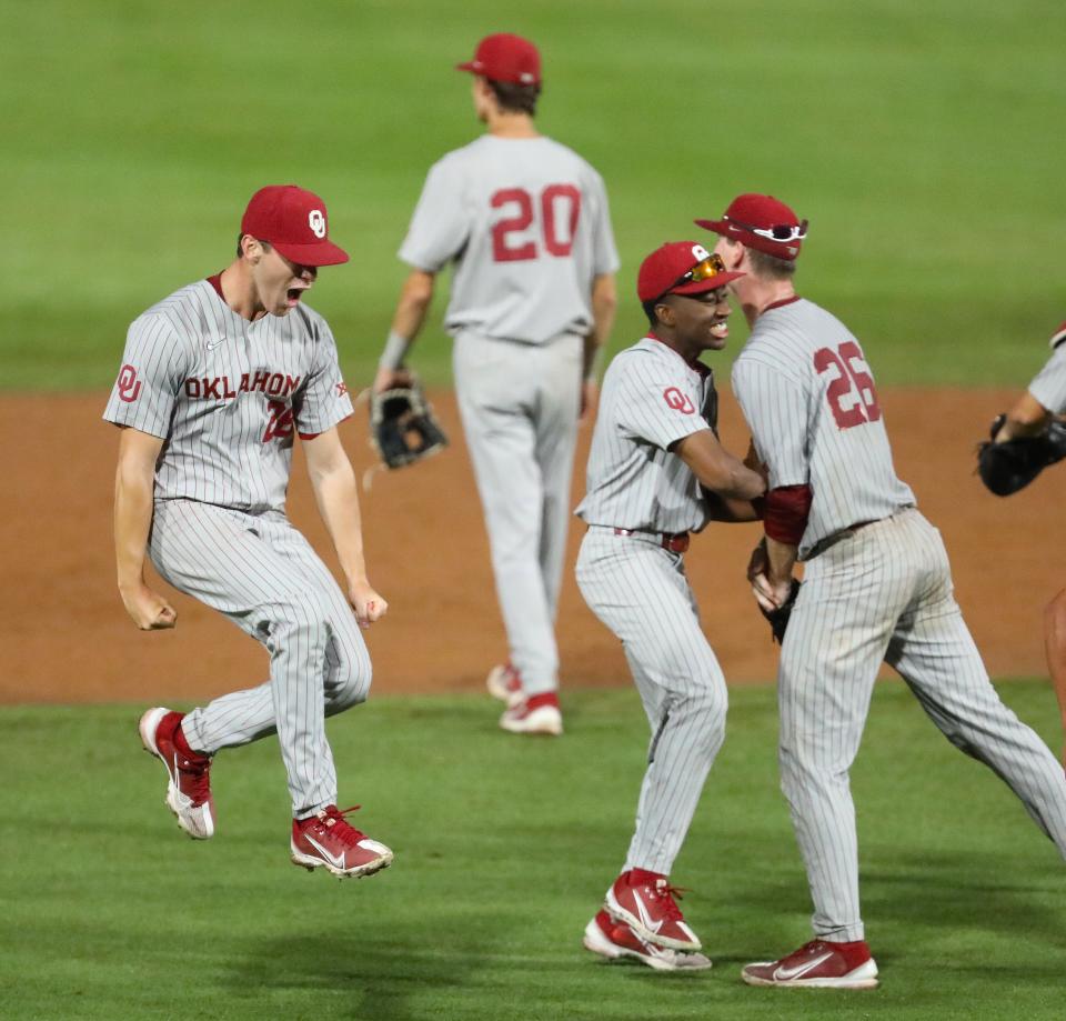 The Oklahoma Sooners celebrate after beating Florida 5-4 Monday night to win the Gainesville Regional at Condron Stadium.