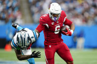 Arizona Cardinals running back James Conner breaks away from Carolina Panthers cornerback Jaycee Horn during the second half of an NFL football game on Sunday, Oct. 2, 2022, in Charlotte, N.C. (AP Photo/Jacob Kupferman)