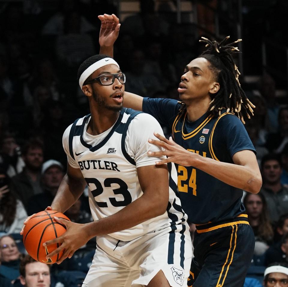 Butler Bulldogs center Andre Screen (23), guarded y East Tennessee State Buccaneers forward Jadyn Parker (24), looks for an opening during the game between Butler Bulldogs and East Tennessee State Buccaneers Monday, Nov. 13, 2023, at Hinkle Fieldhouse in Indianapolis. Bulldogs beat Buccaneers 81-47.