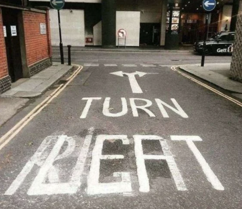 Road marking with a misspelling, should read "TURN RIGHT" but says "TURN BEAT" instead