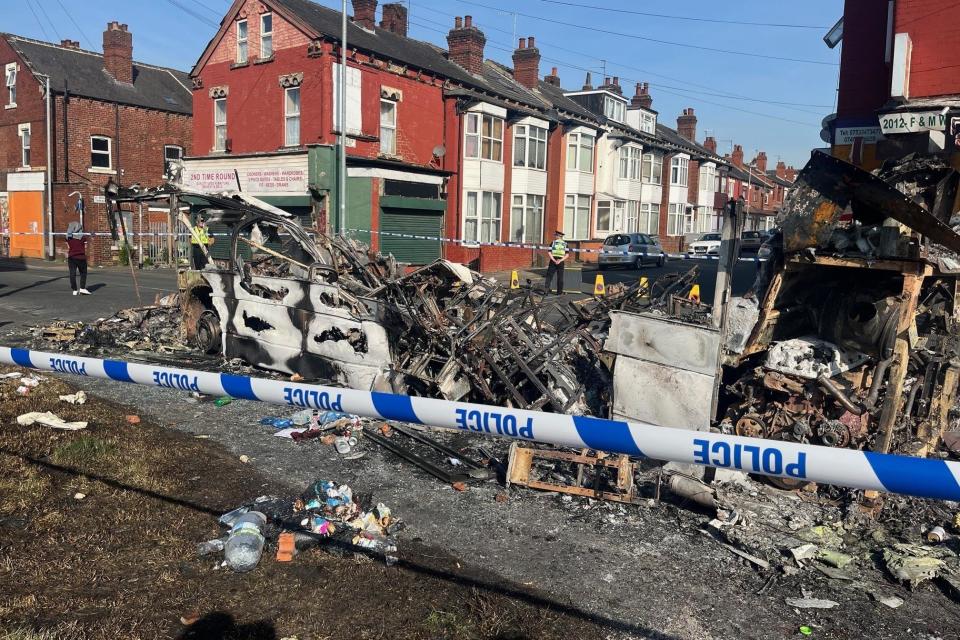 A burnt out car in the Leeds suburb of Harehills, after vehicles were set on fire and a police car was overturned in an outbreak of disorder (Katie Dickinson/PA) (PA Wire)