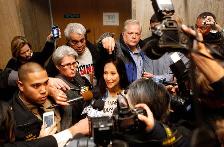 The wife of then-San Francisco Sheriff Ross Mirkarimi, Eliana Lopez, speaks with the press following the arraignment of her husband's domestic violence case at the San Francisco County Court House in San Francisco, California, January 19, 2012. REUTERS/Beck Diefenbach