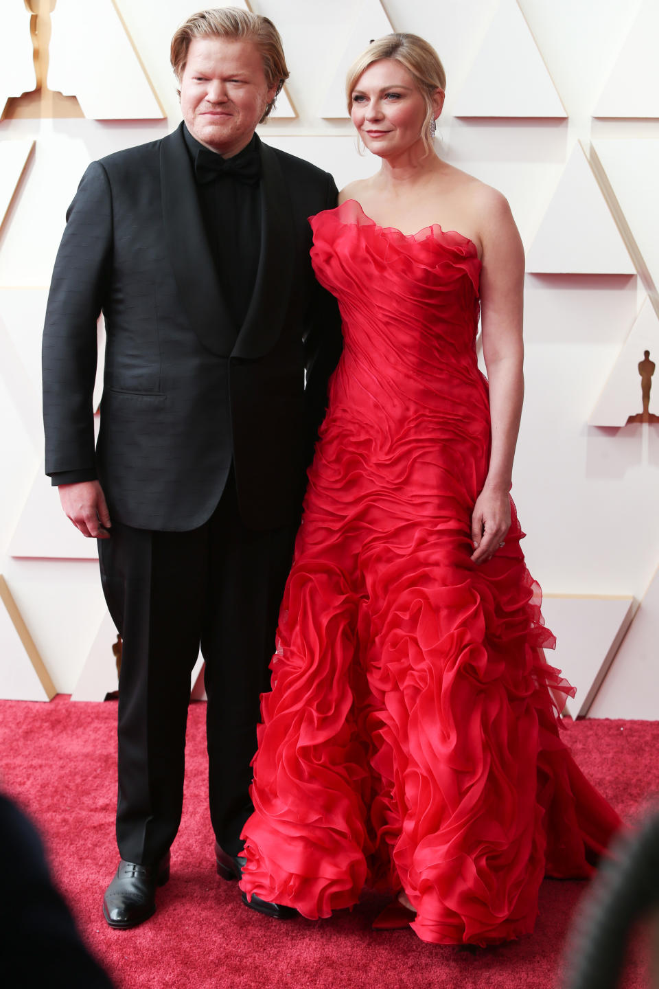 Kirsten Dunst, decked out in vintage Lacroix, and Jesse Plemons at the 94th Academy Awards held at Dolby Theatre at the Hollywood & Highland Center on March 27, 2022, in Los Angeles. - Credit: Lexie Moreland/WWD