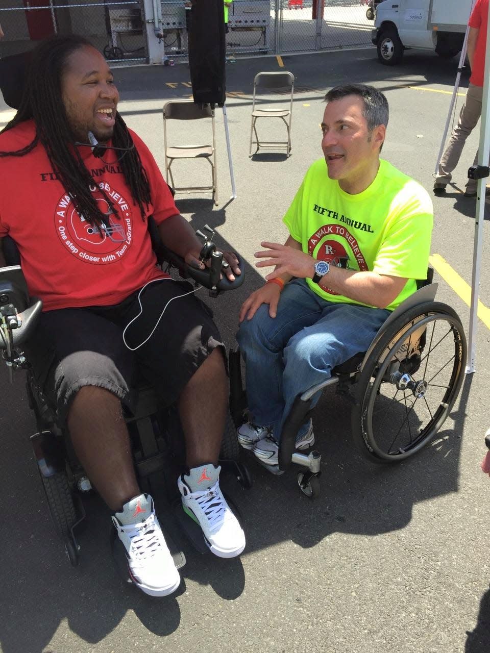 Ron Gold, right, speaks to former Rutgers football player Eric LeGrand
