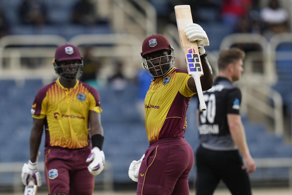 West Indies' captain Rovman Powell celebrates hitting a six to defeat New Zealand by eight wickets during the third T20 cricket match at Sabina Park in Kingston, Jamaica, Sunday, Aug. 14, 2022. (AP Photo/Ramon Espinosa)