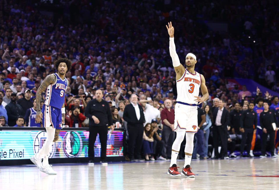 PHILADELPHIA, PENNSYLVANIA - MAY 02: Kelly Oubre Jr. #9 of the Philadelphia 76ers and Josh Hart #3 of the New York Knicks react after Hart's three point basket during the fourth quarter of game six of the Eastern Conference First Round Playoffs at the Wells Fargo Center on May 02, 2024 in Philadelphia, Pennsylvania. (Photo by Tim Nwachukwu/Getty Images)