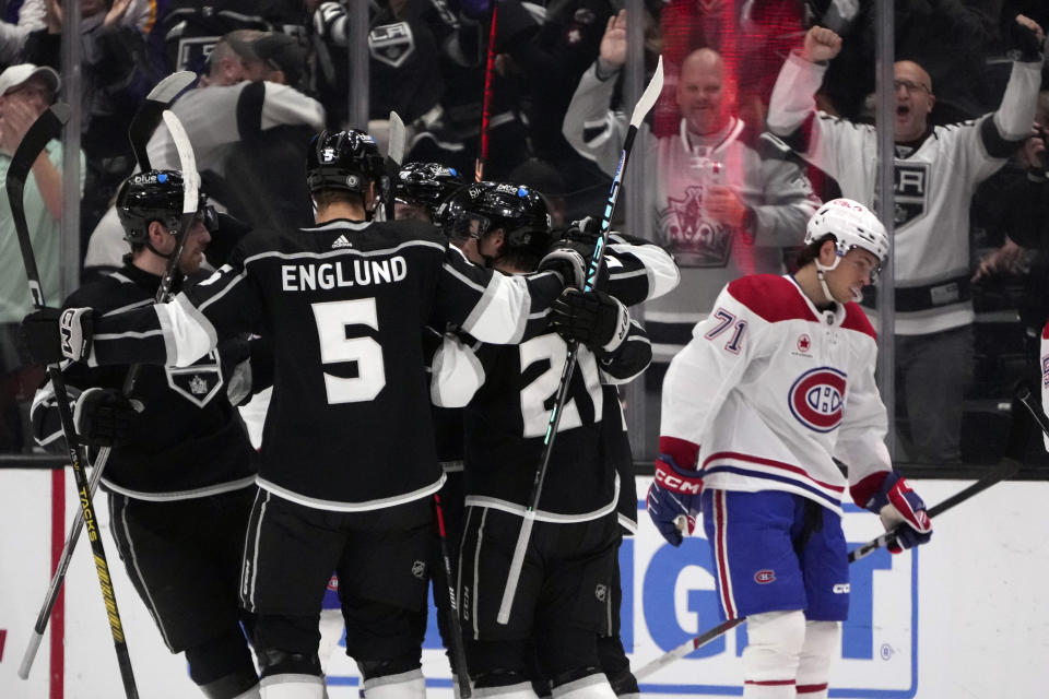 The Los Angeles Kings celebrate a goal by Los right wing Carl Grundstrom during the first period of an NHL hockey game against the Montreal Canadiens, Saturday, Nov. 25, 2023, in Los Angeles. (AP Photo/Marcio Jose Sanchez)