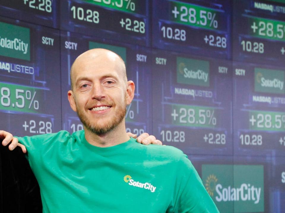 Elon Musk (center) with his cousins and SolarCity cofounders Lyndon Rive (left) and Peter Rive (right) in 2010.