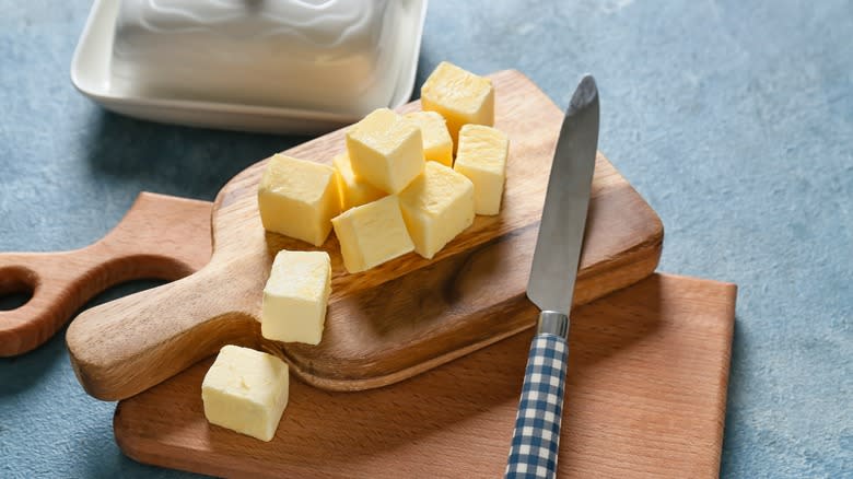 cubed butter on wooden board
