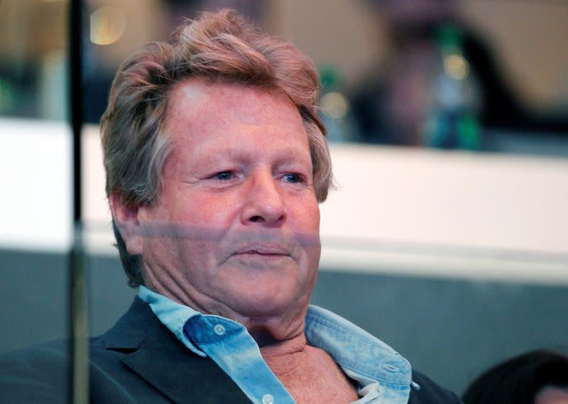 FILE PHOTO: Actor Ryan O'Neal watches the Los Angeles Kings play the Vancouver Canucks during Game 4 of their NHL Western Conference Hockey playoff quarter-finals in Los Angeles,