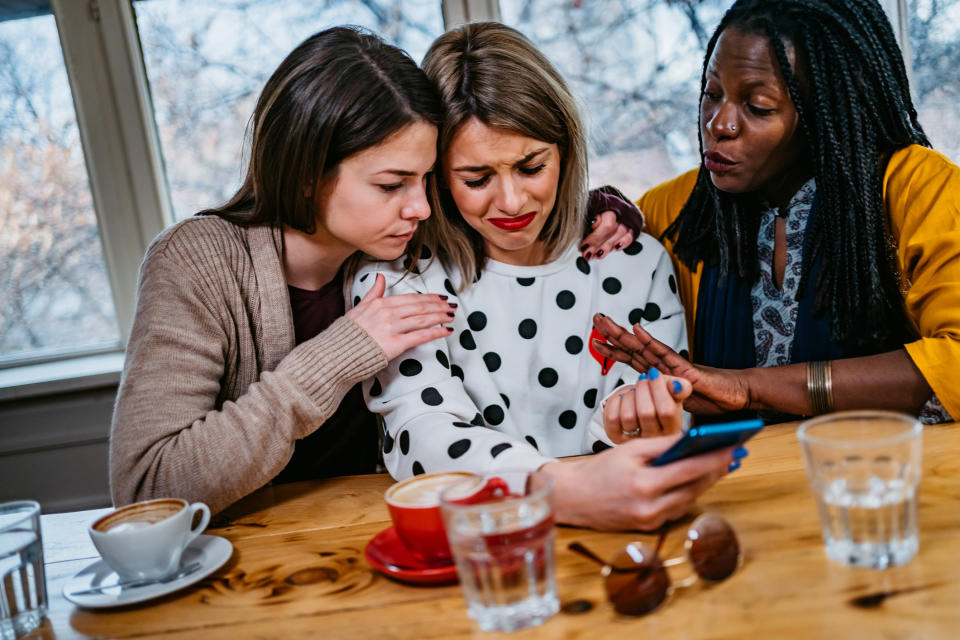 Upset woman with friends