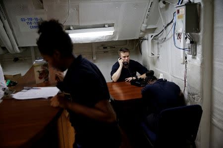 US Navy sailors use phones on board the USS Harry S. Truman aircraft carrier in the eastern Mediterranean Sea, June 14, 2016. REUTERS/Baz Ratner
