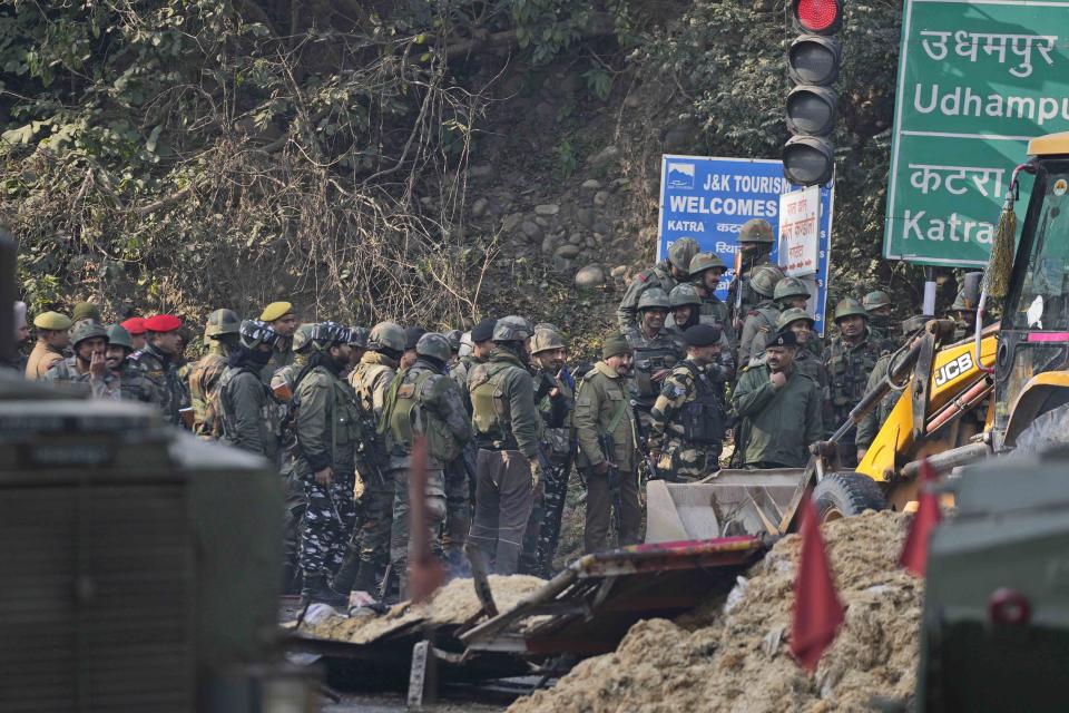 Indian army soldiers inspect the site of a gunbattle at Nagrota, on the Jammu-Srinagar highway, Indian-controlled Kashmir, Wednesday, Dec. 28, 2022. A top police officer, Mukesh Singh, said troops intercepted a truck in the outskirts of Jammu city early Wednesday following its “unusual movement” on a highway. As the troops began searching the truck, gunfire came from inside it, to which the troops retaliated, leading to a gunfight killing four suspected militants, Singh told reporters. (AP Photo/Channi Anand)