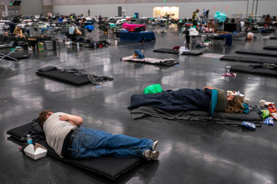 People gather at a ‘cooling centre’ to escape the heat amid record-breaking temperatures in Portland, Oregon (Getty)