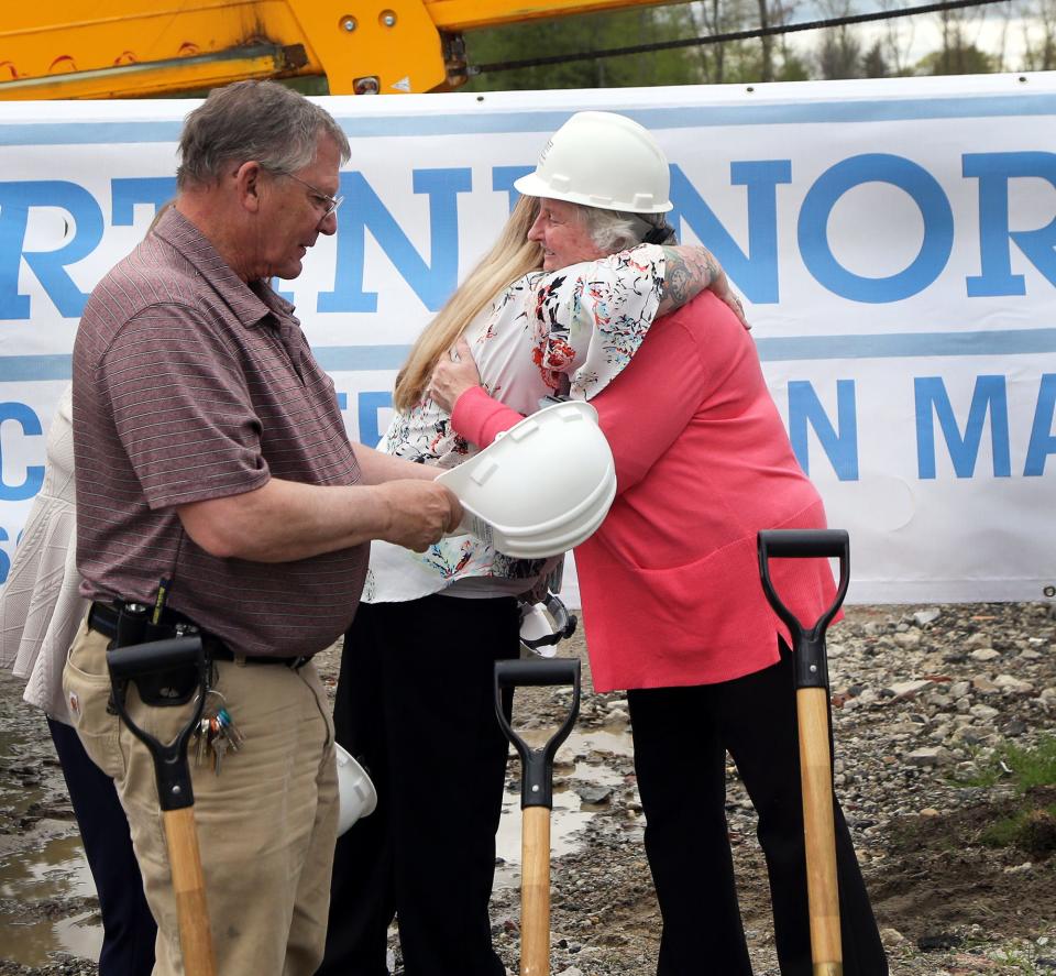 Deborah DeScenza, founder and executive director of Farmsteads of New England, Inc., gets many hugs following the groundbreaking of Redberry Farm in Epping May 9, 2024.