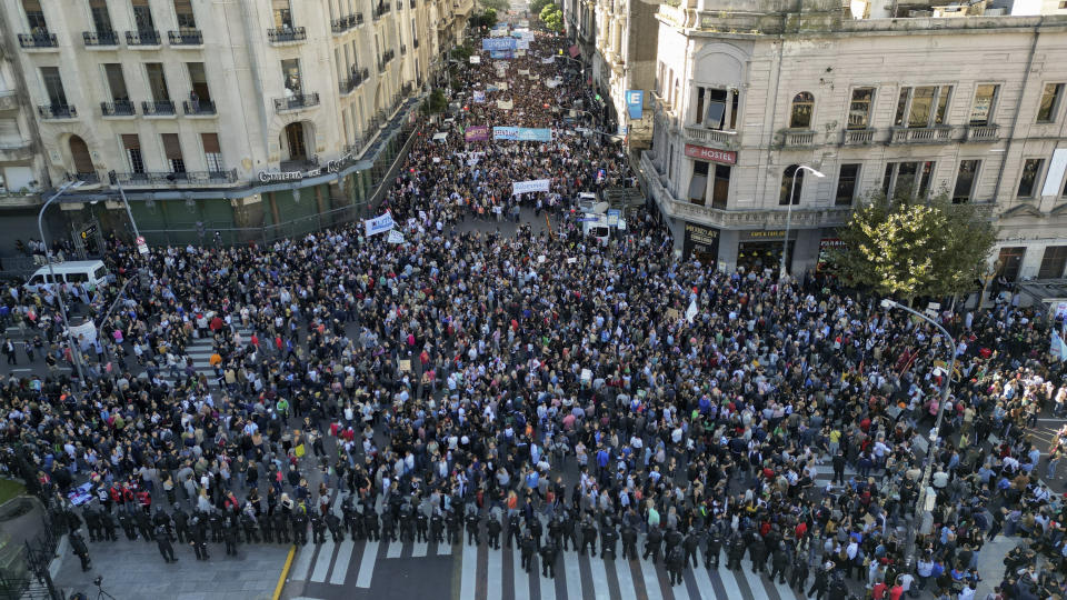 Students march to Congress to demand more funding for public universities and against austerity measures proposed by President Javier Milei in Buenos Aires, Argentina, Tuesday, April 23, 2024. (AP Photo/Rodrigo Abd)